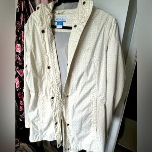 Beige Columbia rain jacket.